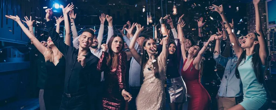 Students celebrating at a prom party after safe chauffeured transportation