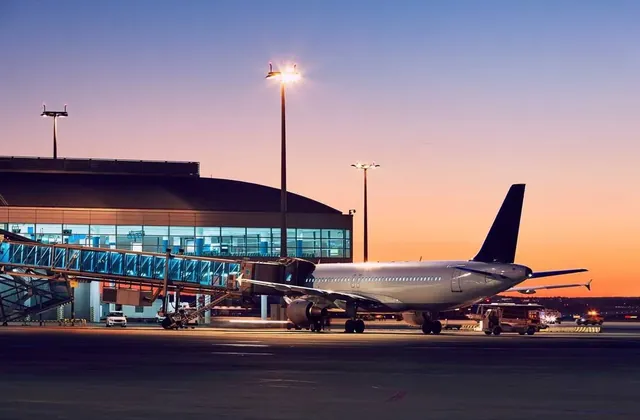 Black car at a DFW International Airport terminal